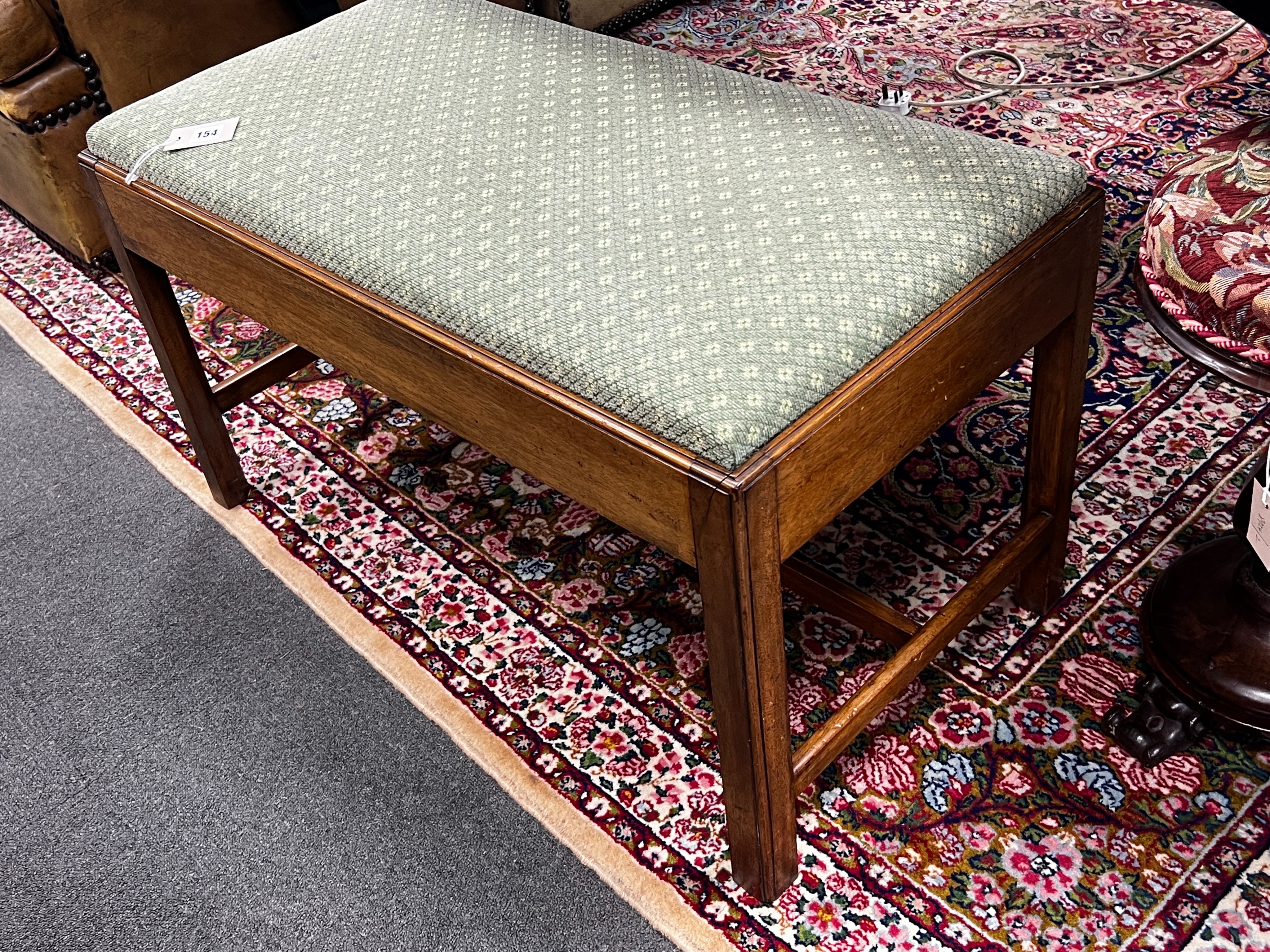 A George III style mahogany stool with upholstered drop in seat, length 90cm, depth 46cm, height 49cm